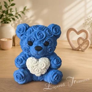Decorative blue 3D printed teddy bear featuring a rose-pattern body and a large white heart on its chest.