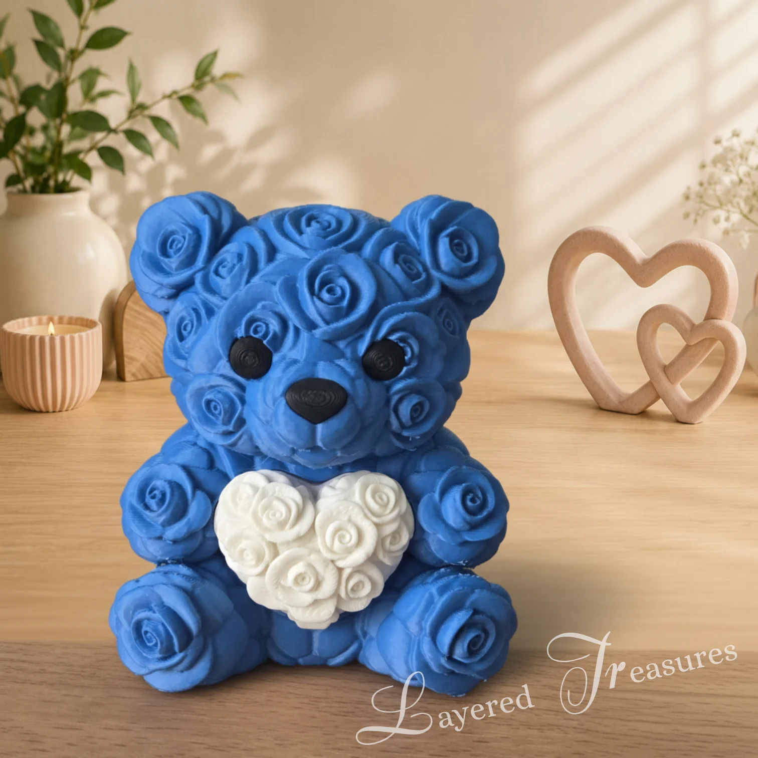 Decorative blue 3D printed teddy bear featuring a rose-pattern body and a large white heart on its chest.